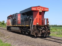 CN ES44DC 3880 heads east out of Sarnia light power on the Strathroy subdivision to rescue a train tied down at Kerwood.