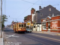 TTC Peter Witt streetcar 2894, operating in Beltline Tour Tram service downtown, heads eastbound on Queen Street West at St. Patricks Square, passing a row of storefronts that include A. Stork & Sons (aptly named for a poultry shop) and the Beverley Tavern. On the left barely visible is 299 Queen Street West, the famed home of CityTV. Most of the buildings here remain today, although somewhat changed.
<br><br>
<i>Robert D. McMann photo, Dan Dell'Unto collection slide.</i>