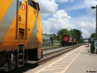 VIA Rail #84 with P42 918 patiently waits as passengers load at the Kitchener, Ontario station as CN L568 with 4732 and 4130 slowly heads west down the siding light power. Soon 84 will continue its journey eastbound to Toronto over the Guelph Subdivision and L568 will head west to Stratford and likely St. Marys.