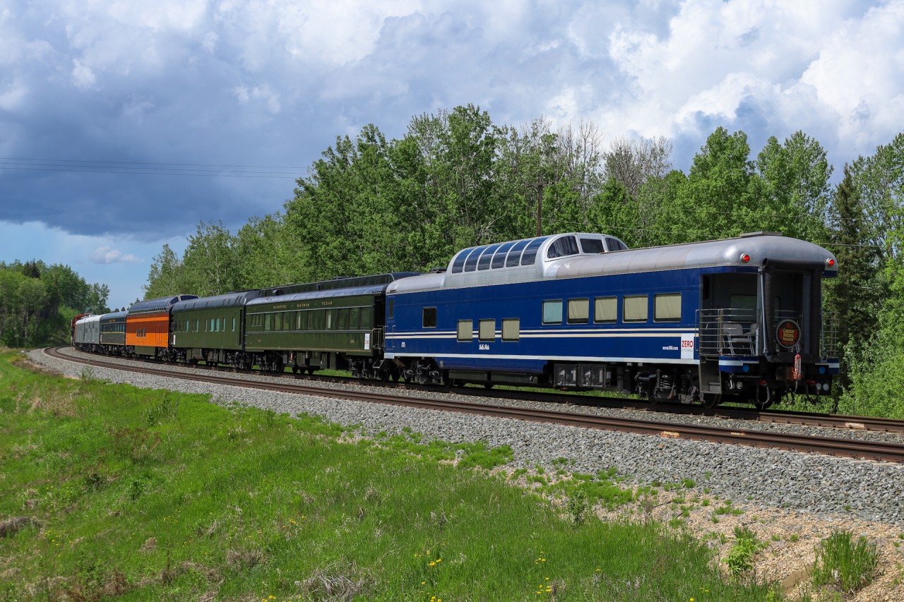 CN P 00981 01 rolls through Stony Plain with CN 3804, CN 8855 and seven coaches from the Milwaukee 261 Steam Program.   The train originated at New Brighton, Minnesota and operated to Jasper, Alberta for the Safety Week Business Train.  

The cars on the train are: 
NSRX 801400
NSRX 801401
NSRX 800482
NSRX 800862
NSRX 800034
NSRX 800393
NSRX 800212