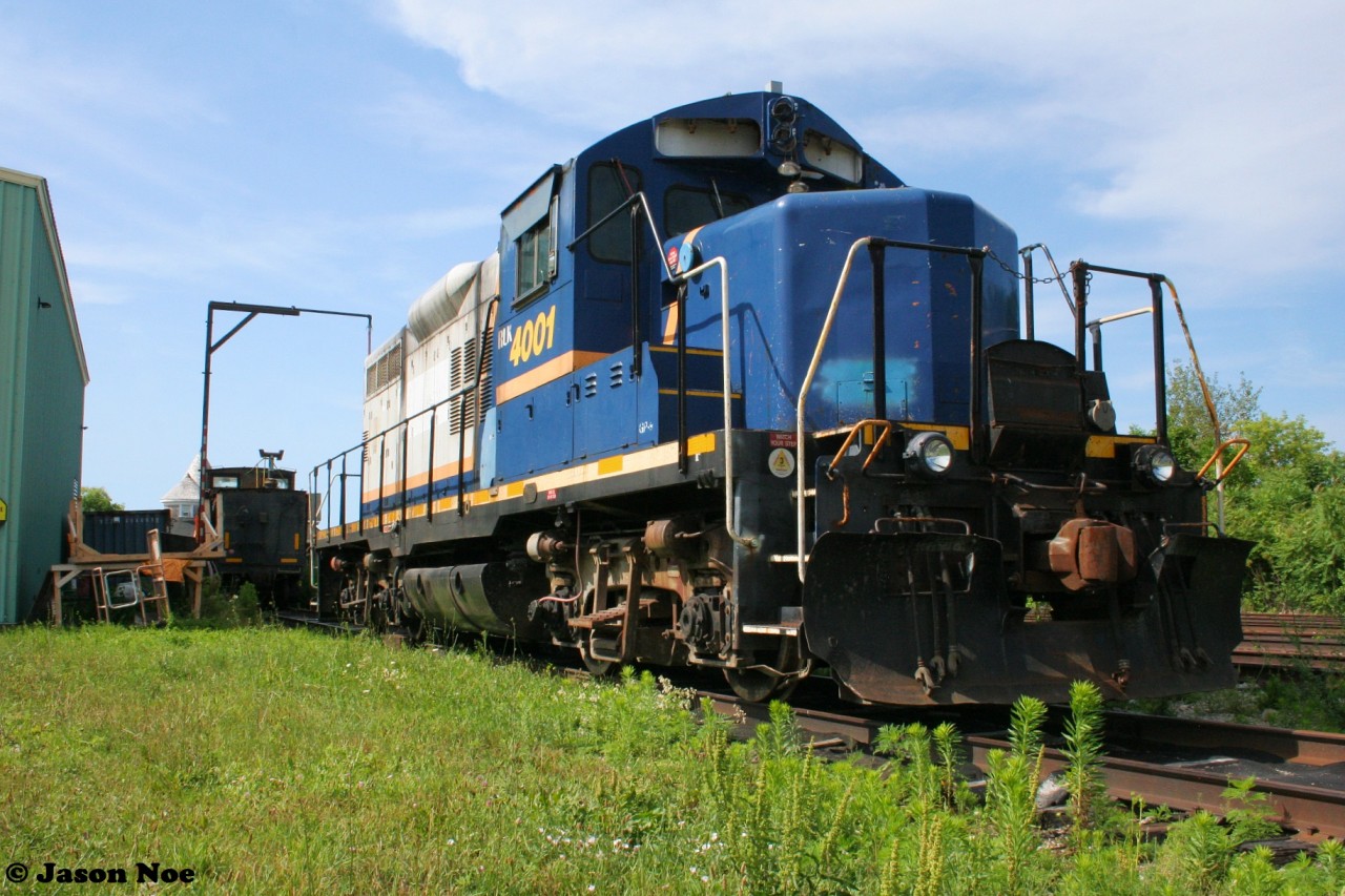 A beautiful summer afternoon finds Rail Link (RLK) GP9-4 4001 stored at Goderich-Exeter Railway’s shop in Goderich, Ontario after being taken out of service earlier in the year. Fast forward, almost one year later and the historic former Southern Pacific GP9-4 still sits in Goderich awaiting a future disposition.