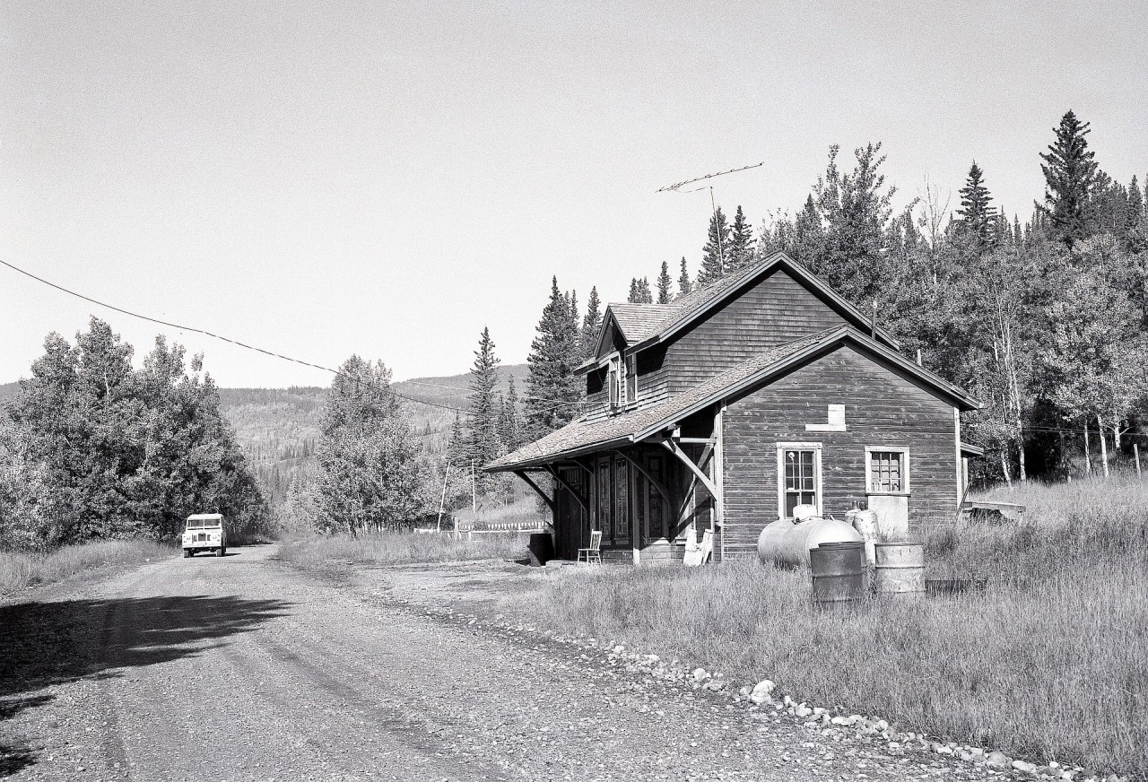 Across the river and along the road noted on the far bank in my photo a couple weeks back at the CN Athabasca River bridge, the Canadian Northern Alberta alignment became Township Road 510A or Old Entrance Road, and the former Entrance depot was still in place when I visited on Monday 1979-09-24, seen here looking westward towards the bridge.  This was part of Canadian Northern Alberta’s Lucerne subdivision, retained by CN from the Athabasca bridge eastward to a gravel pit at Bliss, abandoned in 1932.

To my surprise and total delight, that 1914-built depot survives forty-five years later in 2024, relocated a bit farther back from the river and railway grade onto a new foundation, and now part of the Old Entrance Bed ‘n Breakfast Cabins operation.

My thanks to Les Kozma for his assistance with details in this caption.