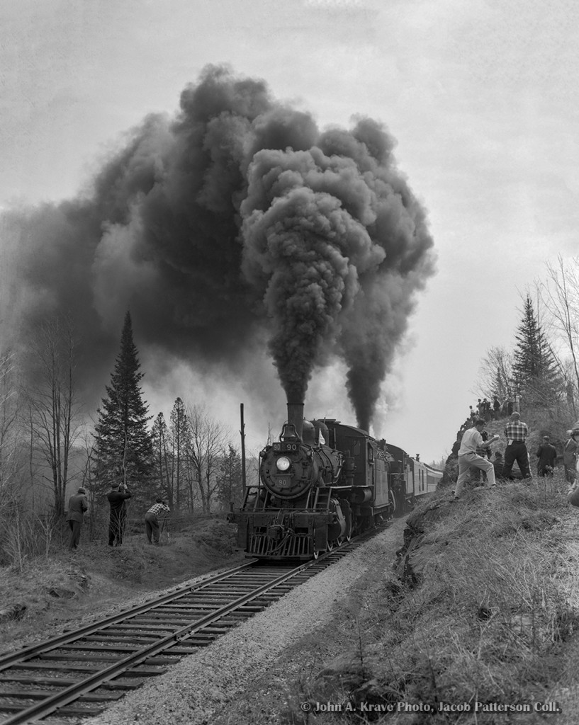 With railfans all around, the joint excursion of the Upper Canada Railway Society and Canadian Railroad Historical Association behind E-10-a 2-6-0 90 and N-4-a 2-8-0 2649 thunders by during a runpast near Ormsby Junction, where the seven mile Coe Hill Sub left the mainline.
Departing Belleville amid the light rain that morning at 0645h - with a crew from the National Film Board setup in the baggage car - the excursion ran along the Campbellford Subdivision to Anson Junction, taking the east leg of the wye onto the Marmora Subdivision. The train would pause briefly at Bancroft before proceeding three miles north to York River where the train could be wyed for the return trip. Arriving back at Anson Junction, the excursion would continue south into Trenton, turning on the wye before returning north to Trenton Junction to rejoin the Oshawa Sub mainline for the short twelve mile run back to Belleville. The special reached a top speed of 55mph on the high iron, running barely 30 minutes ahead of Toronto - Montreal train 6, due into Belleville at 1815h.

Notes of the trip per John Freyseng's extensive article in the June 1959 UCRS newsletter. Neither of these locomotives would last another year, with 90 meeting the torch in February 1960, and 2649 that March.


John A. Krave Photo, Jacob Patterson Collection, 4x5 Negative.  Geotagged location is approximate.