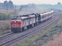<br>
<br>
An all Canadian passenger train.
<br>
<br>
Designed in Canada. Engineered in Canada. Manufactured in Canada.
<br>
<br>
All weather, proven robust design. Operating on time. Reliable too.
<br>
<br>
MLW's at Speed on a steamy Labour Day weekend. 
<br>
<br>
At track speed, two baggage cars - head end and rear - the afternoon Bonaventure: Ottawa section removed at Brockville  
<br>
<br>
The view from the Bee Bridge, September 3, 1978 Kodachrome by S.Danko
<br>
<br>
also
<br>
<br>
Upper right: the Newtonville Rd bridge over the CP Rail Belleville Sub. 
<br>
<br>
Captured by a trustworthy Nikkor 135mm F1.8 lens with a sturdy Nikkormat EL.
<br>
<br>
