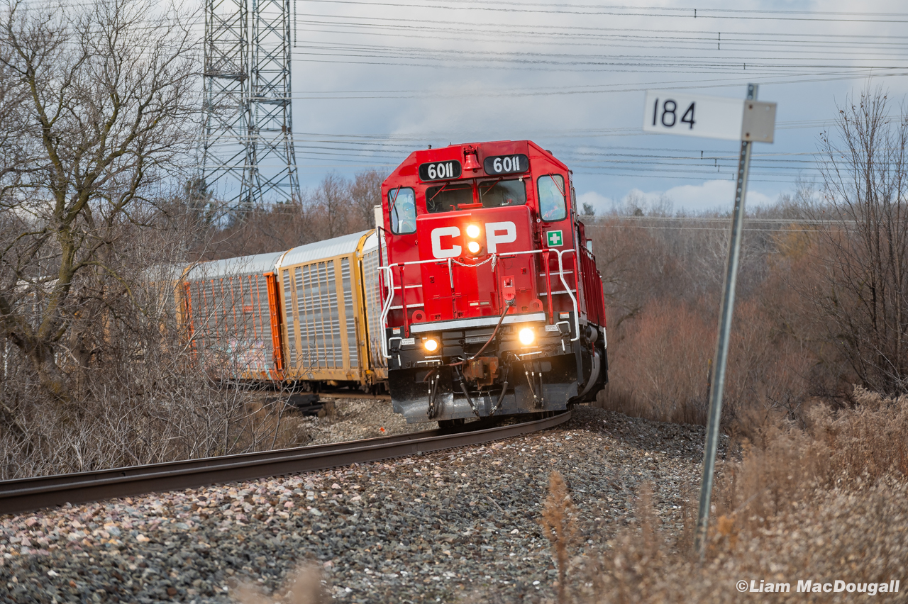 In November a pair of SD40s came down into the GTA on a loaded rail train, and after returning to Toronto Yard from a stint of rail dropping on the Galt Sub, I was anticipating the pair would take at least one spin on the H17/H19 loop. Sure enough, this H19 provided with 6011 taking the lead here at mile 184 of the Belleville Sub.
11/28/2024