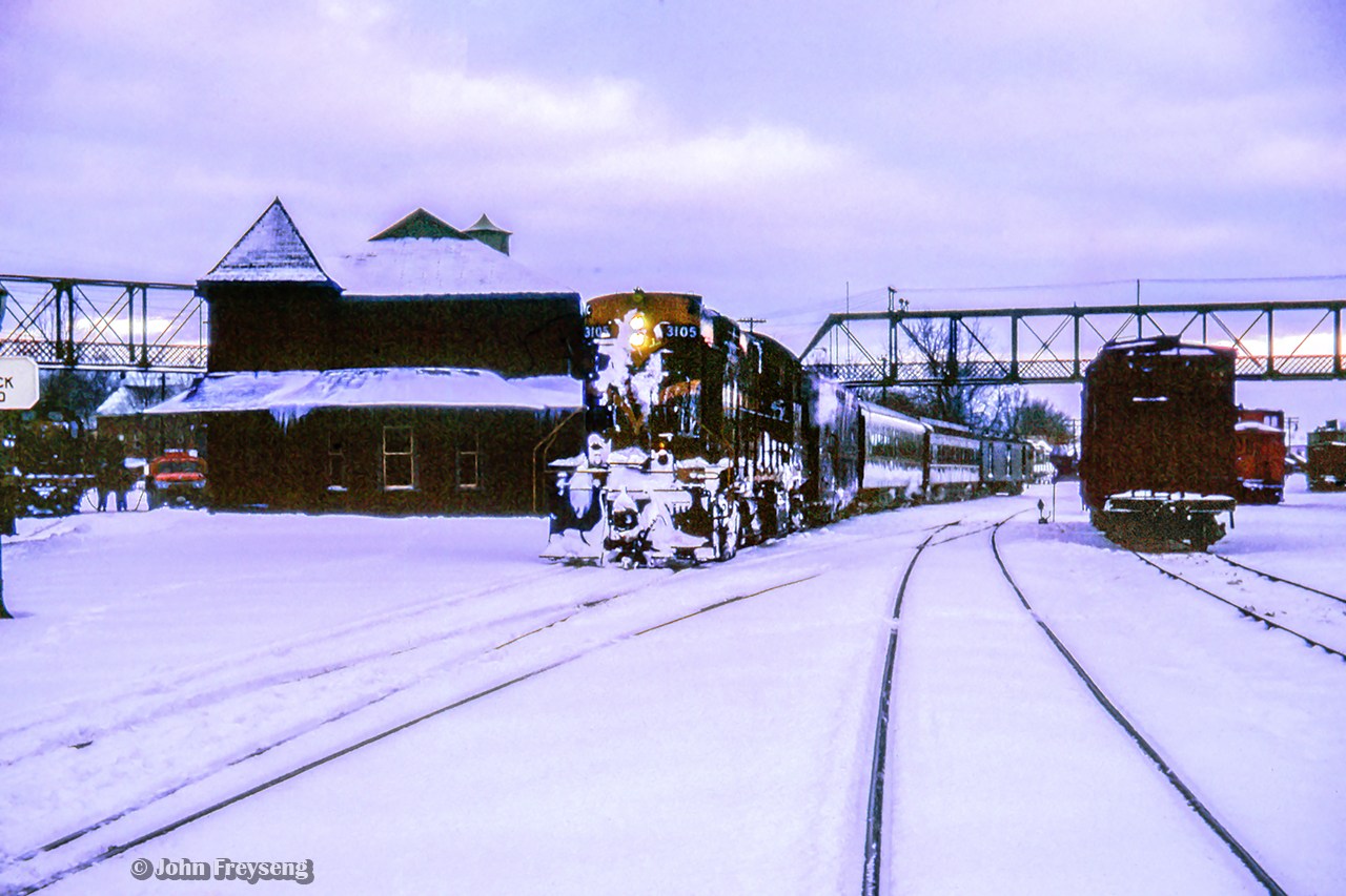 CN train 672 from Owen Sound arrives at Palmerston with conventional passenger equipment trailing RS18 3105.  While typically equipped with RDCs, conventional equipment would return to the branchlines during the Christmas season, while the Budd cars were added to Niagara-bound trains.

Several UCRS members made the trip to Palmerston on Boxing Day, 1962, to ride the wayfreight to Kincardine. The train, which ran as an extra, was not using a van for the tailend crew due to a shortage, but rather an old combine, giving the train the appearance of a mixed train. Regular passenger service on the Kincardine Sub still remained in 1962 in the form of one RDC trip. With releases signed, UCRS members were permitted to ride the "mixed," and with two at a time permitted to ride the flanger which departed for Listowel behind a pair of MLW RSC-13s; 1709 and 1732.

Further details can be found in the February 1963 UCRS newsletter.

Later that day, Extra CNR 1732 at Brussels.

Scan and editing by Jacob Patterson.