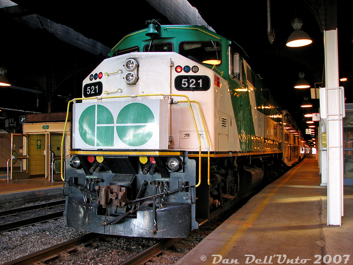 GO Transit F59PH 521 has just arrived at Toronto's Union Station on Track 1 (platform 3) off late morning train #254 from Bramalea (departing 10:15am, arriving at Union 10:48am), and is waiting for its final passengers to disembark before laying over and switching ends to cab car 226 for the trip back out on #257 at 11:30am (working the afternoon "Bramalea Flip" runs).
The Track 1 spot here was always good for a photo while heading to/from the bus terminal or GO concourse, and also allowed one to check the builder's plate of every F59 that still had one - 521's check on this day showed serial A-4746, class GCE-430G, build date 8-88, manufactured at GMDD London, Canada.