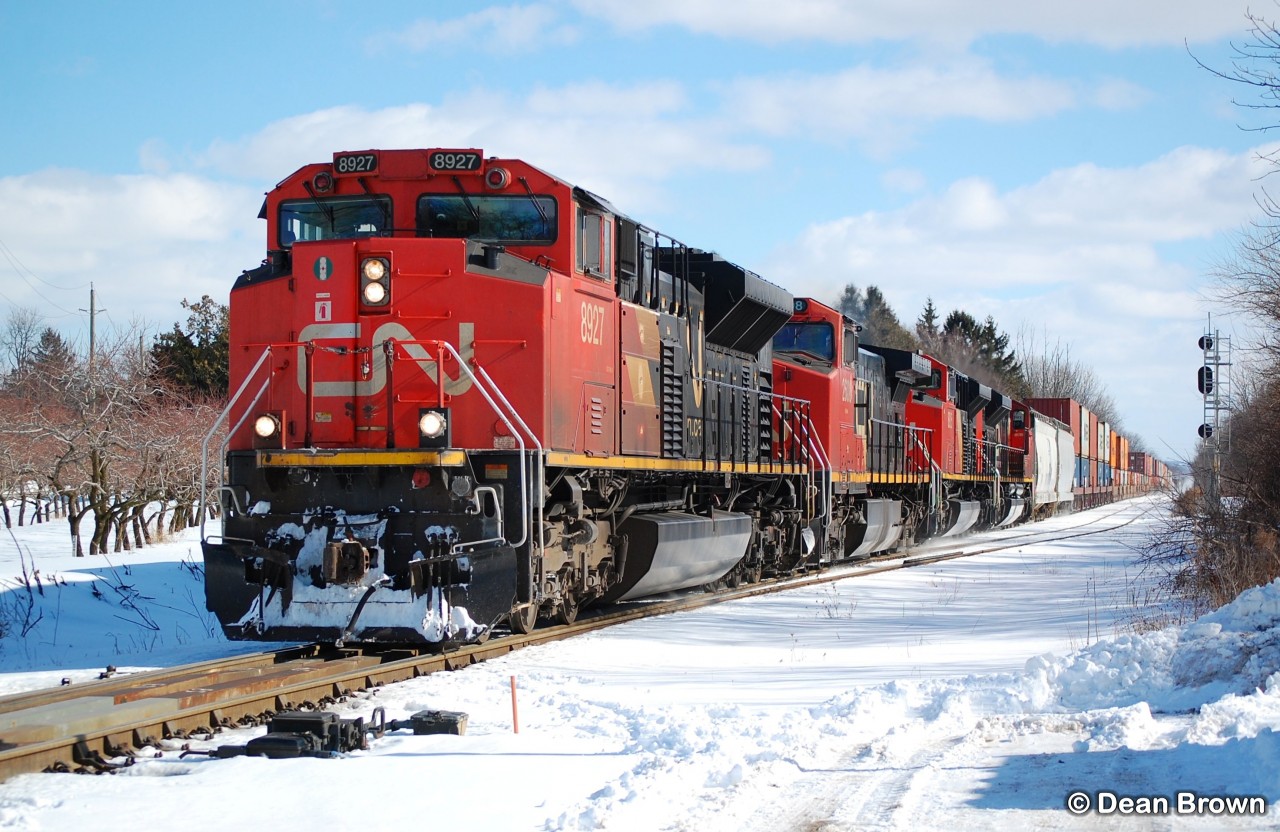 A42231 10 with CN SD70M-2 8927, CN C44-9W 2608, CN SD70M-2 8925, and CN SD70M-2 8881 at Mile 16.5 (Jordan) on the CN Grimsby Subdivision at 12:33 on Feb 10, 2025.