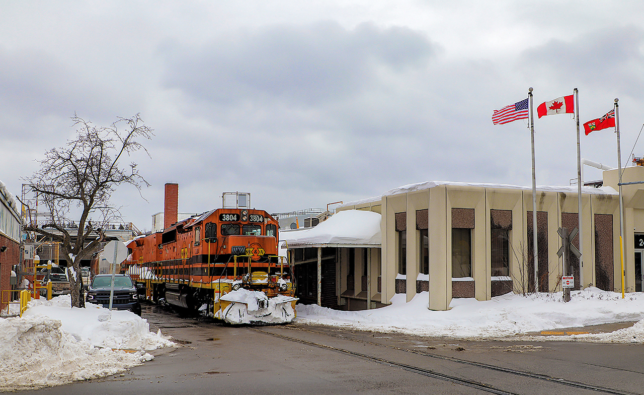 While sitting just up the Guelph Sub waiting for GEXR 582 to return to The York Road yard, from behind me I see train headlights coming towards me. It was GEXR 583 with STL&A 3804 and its slug mate STL&A 804. Out I jumped and they pulled up right in front of me and the conductor dismounted and threw the switch to head down the spur. I've never saw a train head that direction so off I went to a few locations to shoot it . I figured it was going to Owens Corning and was right. They retrieved the two cars and headed back across York Road. The wind and flags cooperated nicely. Thanks to Jacob in aiding in the editing.