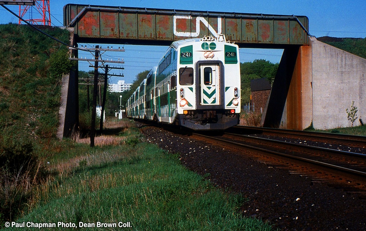 A Westbound GO 157 with GO Cab 241 passes under the CN Halton Sub.