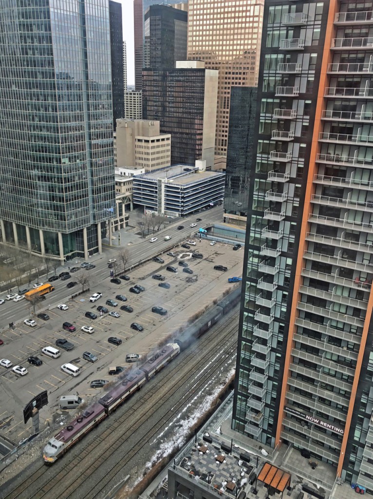 A short Royal Canadian Pacific train is seen making its way though downtown Calgary on a cloudy Friday evening for a quick trip to the west.