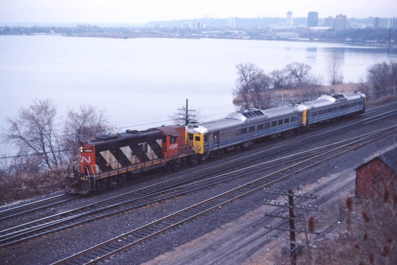 For many years, RDCs held down the Niagara Falls trains. Checking old passenger timetables, this seems to have started with the October 1961 "change of card" where RDCs from the Falls would connect with through trains which ran into/backed out of Hamilton. (Fun fact--until that time, the evening conventional train carried a Niagara Falls-Montreal sleeper, "open for occupancy at Niagara Falls 6:45 pm"! There was also a Montreal-Niagara Falls sleeper on the morning train.) At the spring 1962 timetable change, CN moved the connection out of Hamilton by extending three RDCs each way to Dundas--a practice which only lasted until the fall of 1962 when RDCs protected two of three Toronto-Hamilton-Niagara Falls trains (the third schedule was a conventional train). By the late 1960s, RDCs had become the norm (typically three Budd car sets, but often four cars on holiday weekends). By the 1980s, VIA was still running three trains per day but generally with two RDCs on the two Niagara Falls return trips (with Amtrak equipment on the Maple Leaf to and from New York starting in April 1981). On 16 November 1986, something clearly has gone wrong since we have CN GP9 4590 leading the usual pair of RDCs on the afternoon train from Niagara Falls.
P.S. RDCs would last on these trains until the great January 1990 VIA cutback when they were retired and replaced by conventional equipment. Service was reduced to one VIA consist and one Amtrak consist in each direction. Today, only the Maple Leaf runs--the second train having been cancelled at the end of October 2012.