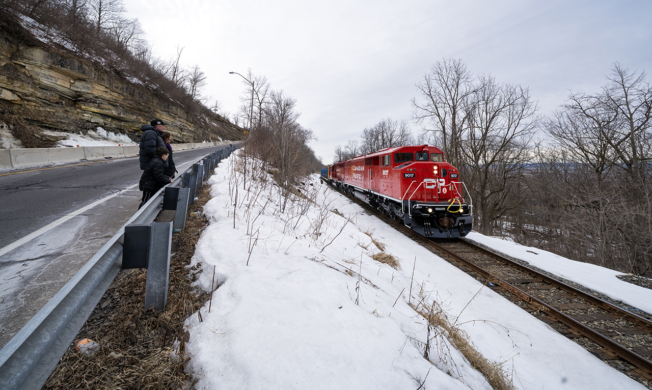After dropping rail outside of Kinnear Yard, the CP CWR train climbs up the Niagara escarpment on the Hamilton Sub, past Dewitt Rd enroute to Smithville where they will spend the night, with plans to work the Ham Sub the next day and return to the Galt Sub by night fall. However since taking this photograph, this CWR train has tied up in Smithville multiple times over the last week and a half...as work took longer than originally anticipated. Obviously. For those who are in search of this train, by the time this gets approved, it should be tied down either in Galt or on the Waterloo spur somewhere (with two Geeps, no SD40's). *Here* is a shot from Reg Button of CP RS18 8733 and four other units featuring three TH&B units trudging uphill with a rock train at the same spot, fourty one years ago next month.