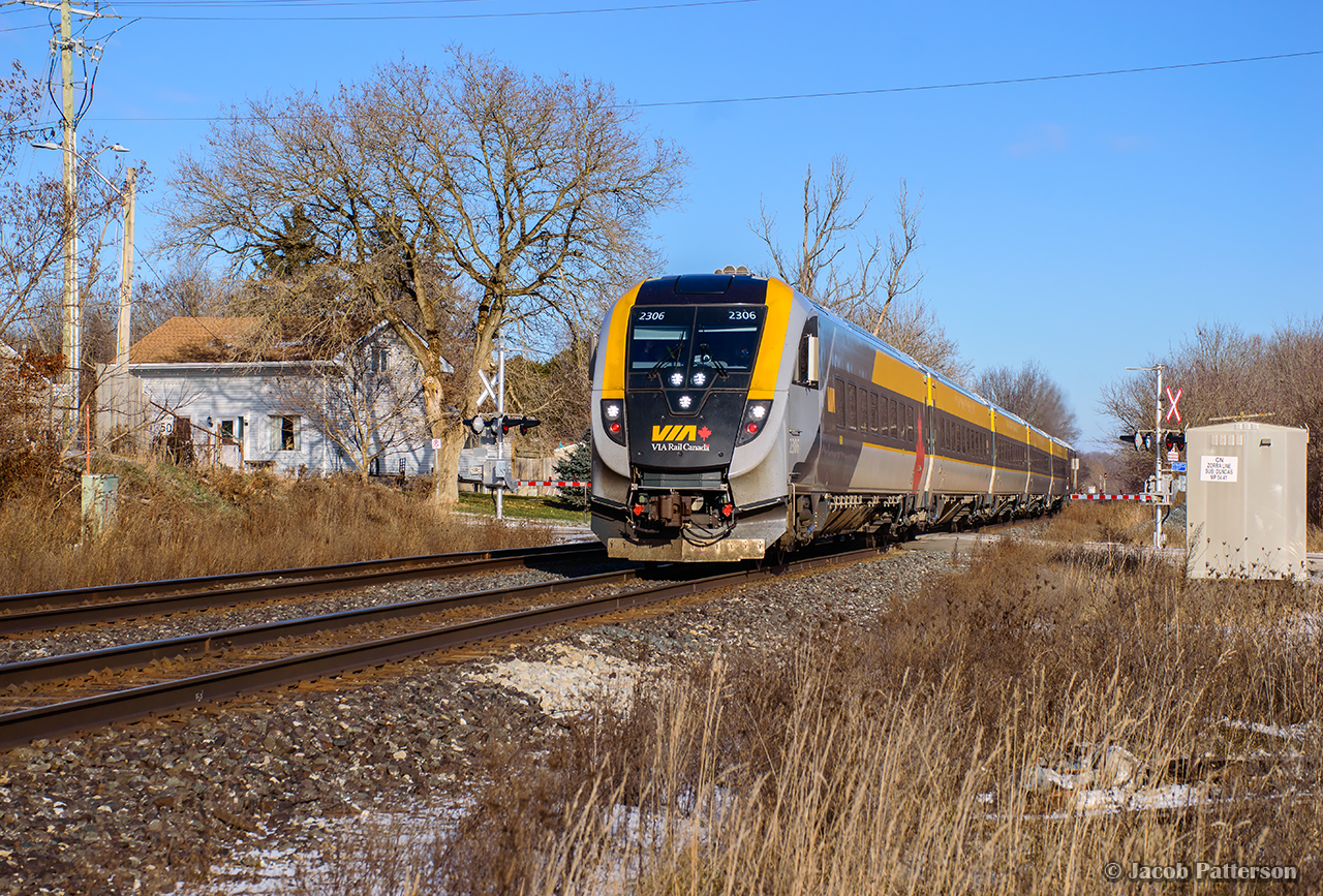 Venture-equipped VIA 73 blasts through the village of Beachville, passing the former station site at Zorra Line.