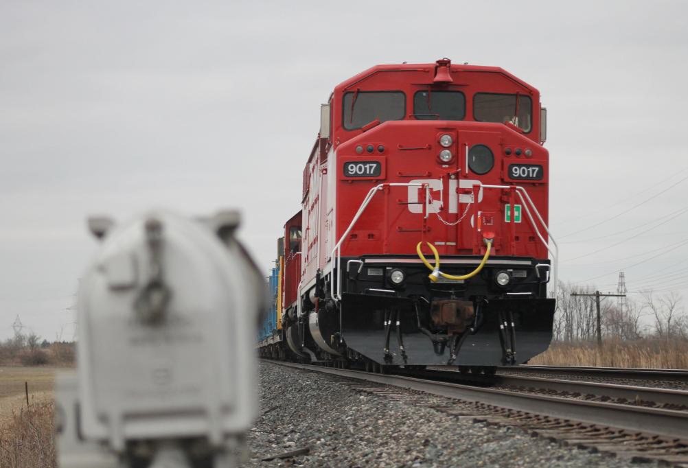 CP 9017 is seen tied down after dropping the last string of rail along the Tilbury siding.