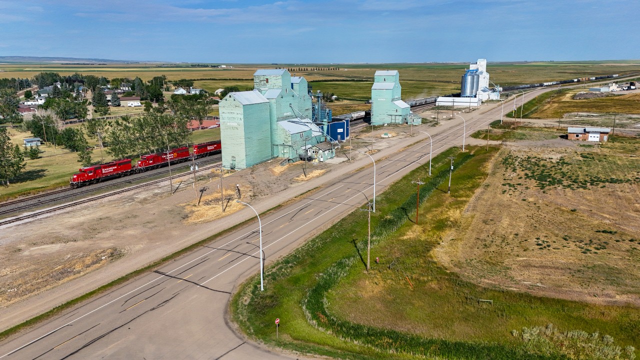Caption: CPKC B08-30 rolls through Warner, Alberta on the Montana Sub. The train operates daily from Lethbridge to Coutts, Alberta where they interchange with BNSF at Sweetgrass, Montana. Power today was CP 5007, CP 6231 and CP 5036 with 58 cars