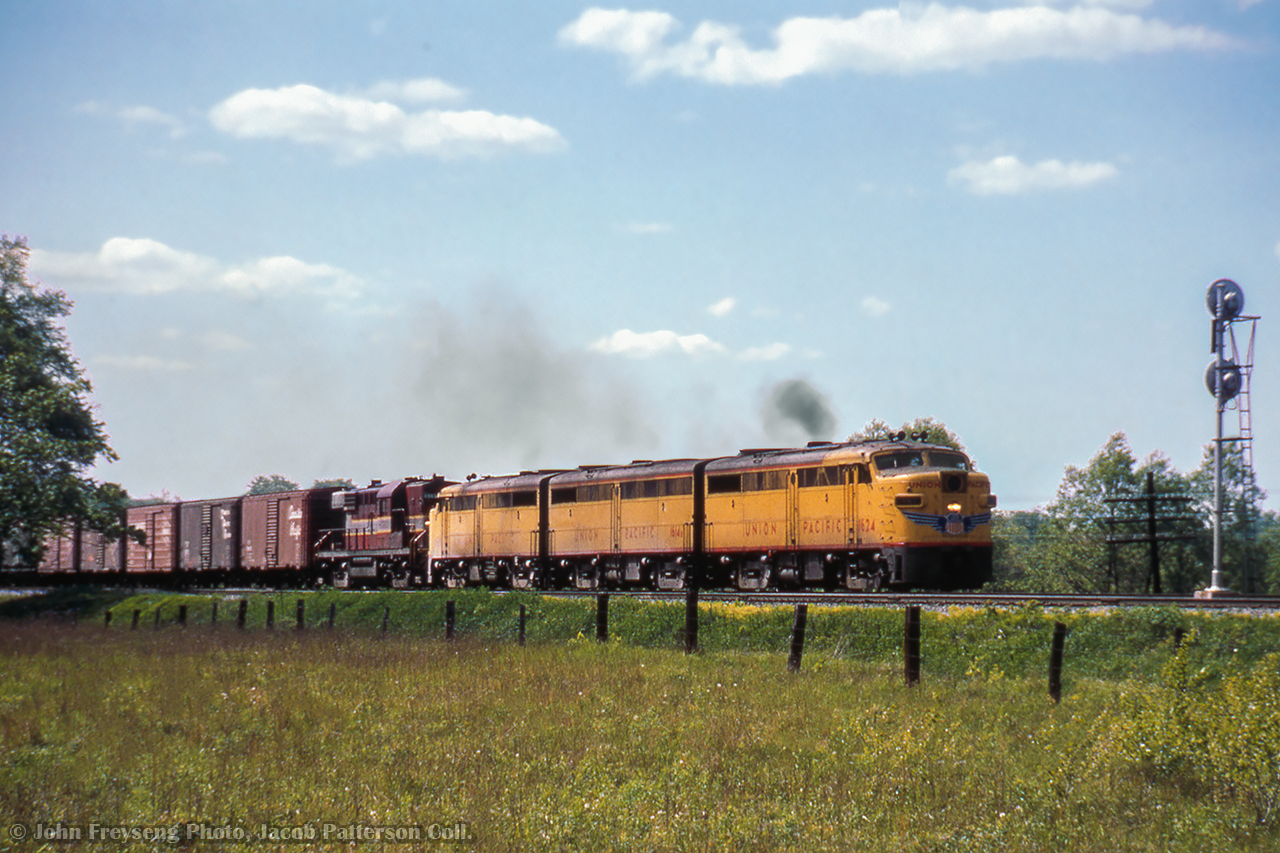 During a period of increased grain shipments to the Soviet Union, leased Union Pacific ALCO FAs lead an eastbound timetable freight at the east end of Darlington.

John Freyseng Photo, Jacob Patterson Collection Slide.