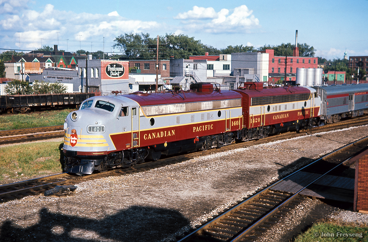 An evening view from the old Weston Road bridge, Vancouver-bound CPR 11, The Canadian, gets underway from West Toronto station, about to take the crossover onto the Mactier Subdivision.

Scan and editing by Jacob Patterson.