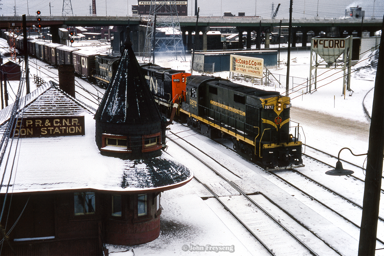Running Mimico - Capreol, CN 409 passes Don station and the S. McCord concrete plant.  Shortly after 409 passes, train 452 from North Bay will make an appearance behind a pair of ONR RS3s.

Scan and editing by Jacob Patterson.
