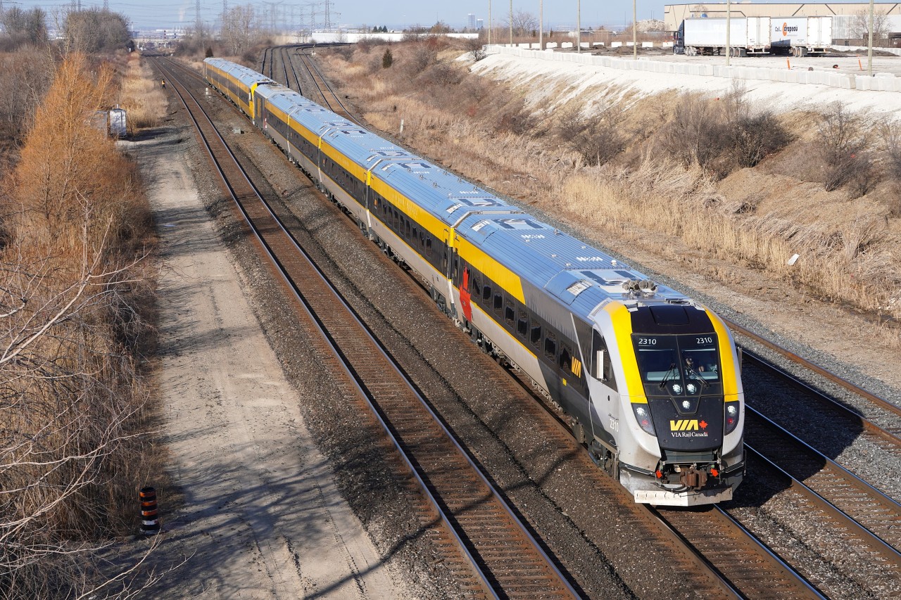 Due to a closure of the MX Kingston Sub on this weekend for planned construction, VIA Trains had to detour along the MX Bala Sub and CN York Sub in order to travel between Liverpool and Union Station however there was different routing with J trains 60/50 & 62/52 which was to take the MX Newmarket Sub and make a reverse move onto the CN York Sub at Snider and then head Eastwards while the rest of the corridor trains took the usual detour. After coming off of the North connecting track and taking 2 crossovers to the South track, VIA 62/52 J Train with set #11 and #18 "Lumi" are seen backing up past the dwarf signal in order to clear the controlled location to get their light Eastwards. This made for a rare shot of a corridor set in revenue service at a spot that usually only sees CN freight and VIA's "The Canadian".