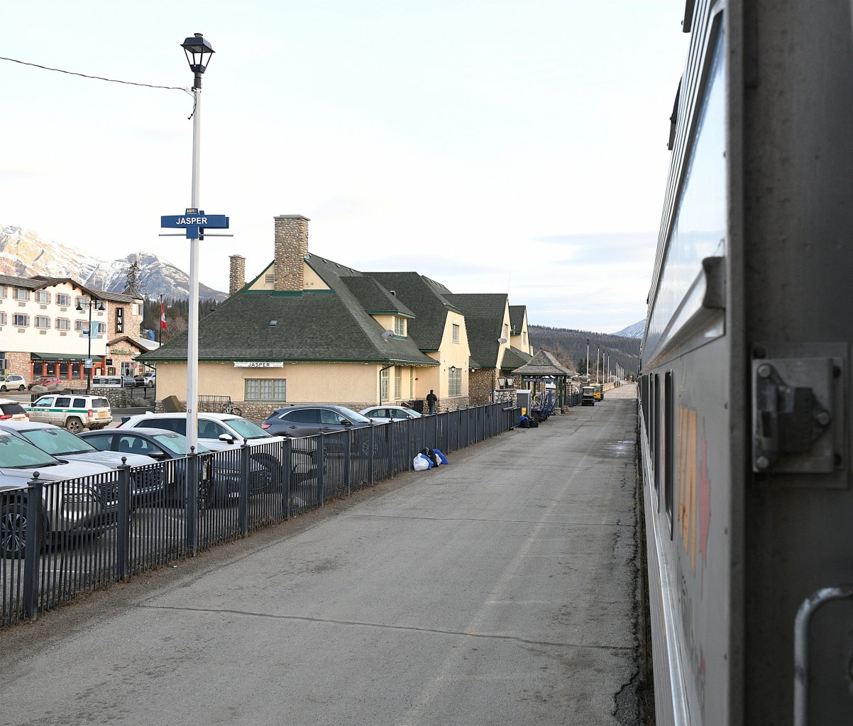 Vestibule shot in 2025 
With the top half of the Dutch door still open, I grabbed this shot of VIA 001 just before departure from Jasper, AB. 
An original marker lamp hanger bracket is still bolted to the end of the sleeping car. 
Both Whistlers Inn at the left of the frame, and the VIA Rail station were spared by the forest fire that went through the town last summer.
