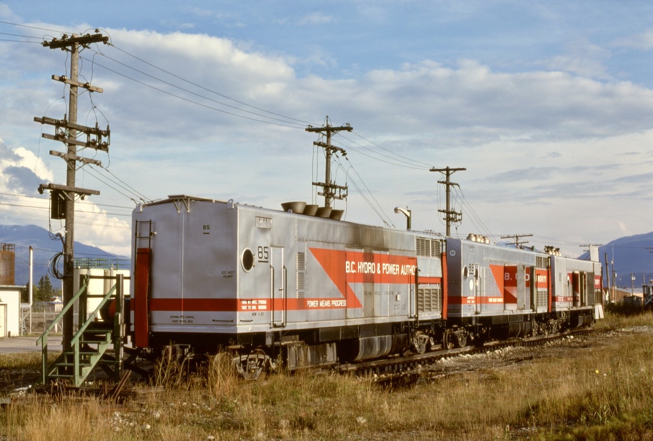 To augment stationary generating capacity as demand increased, BC Hydro & Power Authority had a small fleet of generator boxcars, like these three 1000 kW examples numbers 85, 89, and 88, at McBride on Friday 1977-09-16.  Their EMD 567 engines sounded just like locomotives, and the sound baffled me when standing at the CN depot just 0.3 mile east — there must be one heavy eastward freight approaching!