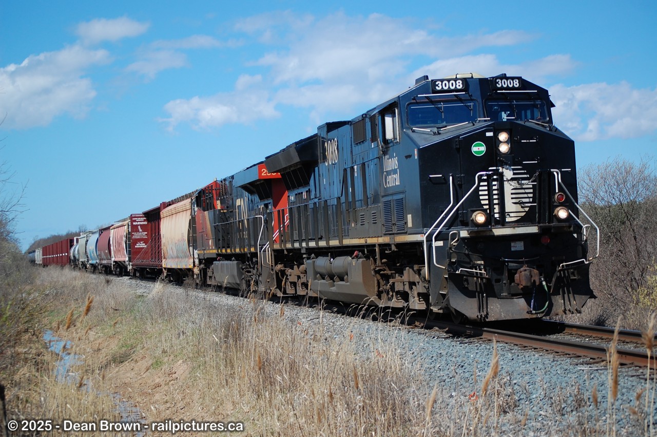 CN 562 with IC ET44AC 3008 and CN ES44AC 2931 at Schisler Rd.