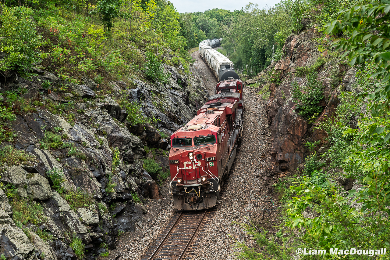 On a quite chilly, overcast summer afternoon, CP 231 motors westbound through a beautiful rock cut near the small township of Christie Lake, Ontario. At first glance you'd expect a photo like this to be from the Muskoka area, but the eastern leg the Belleville Sub finds itself in some equally breathtaking scenery for a little while as it takes a more northern path compared to the Kingston sub enroute to Montreal.