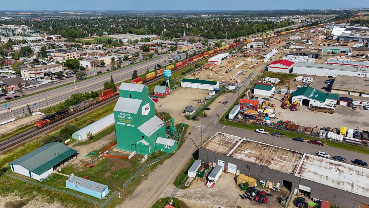 Q 10131 18 cruises through Spruce Grove, past the old elevator which is now a museum.