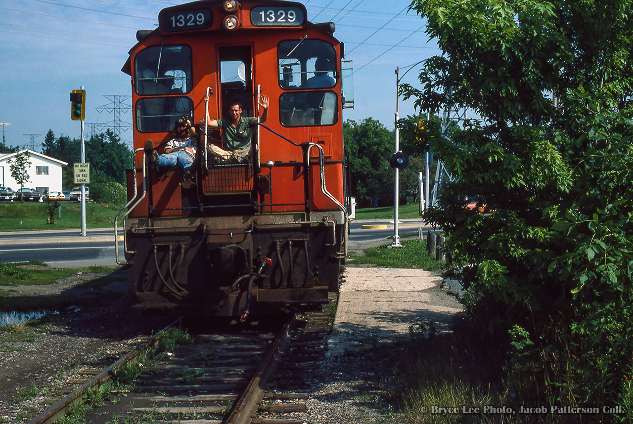 Waving to the camera, CN 1329's crew takes it easy, enjoying the weather on the rear of the unit as they trundle north light power at Lakeshore Road.


J. Bryce Lee Photo, Jacob Patterson Collection Slide.