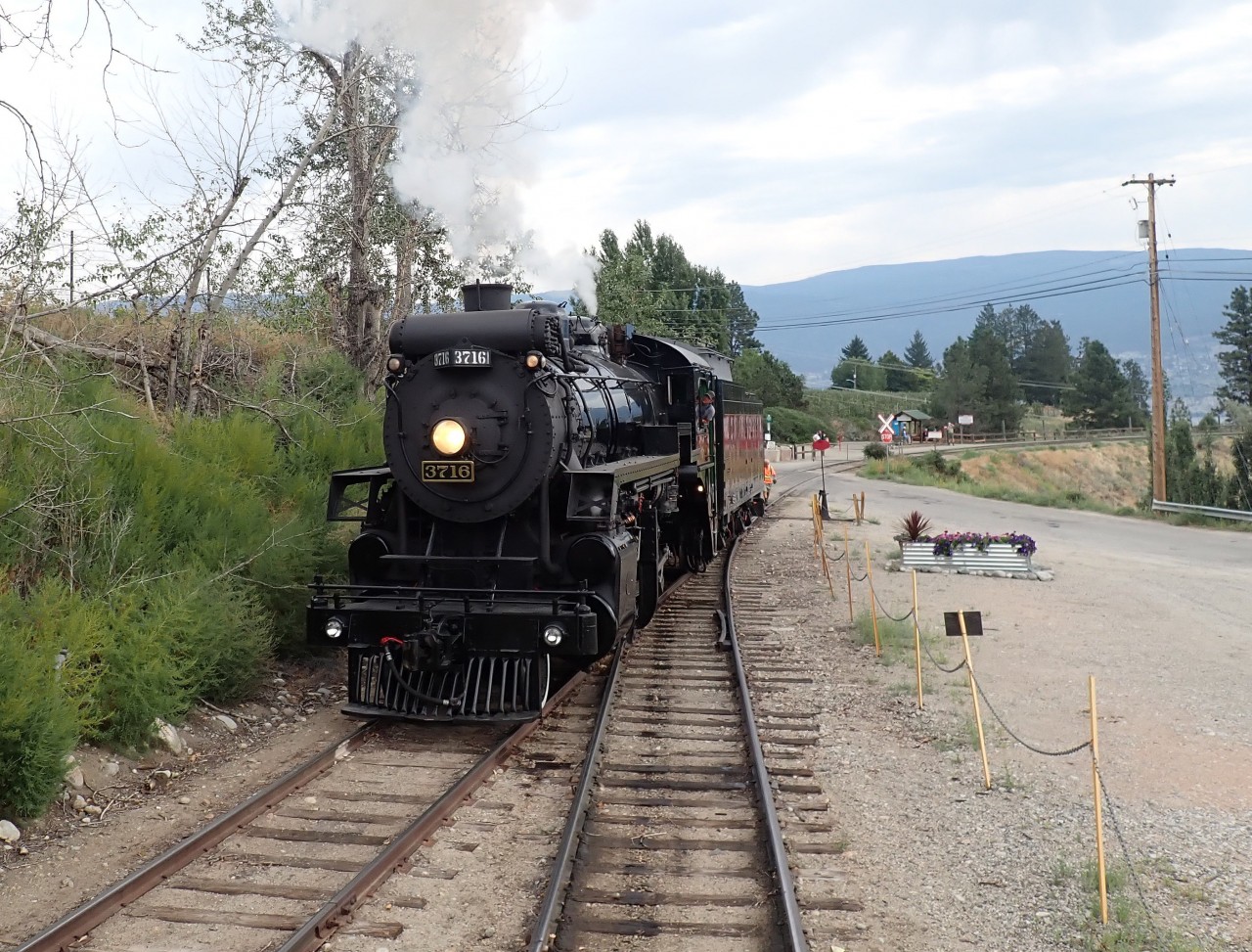 After a stop on the Trout Creek trestle, Kettle Valley Railway's ex CPR 3716 is running around the train .