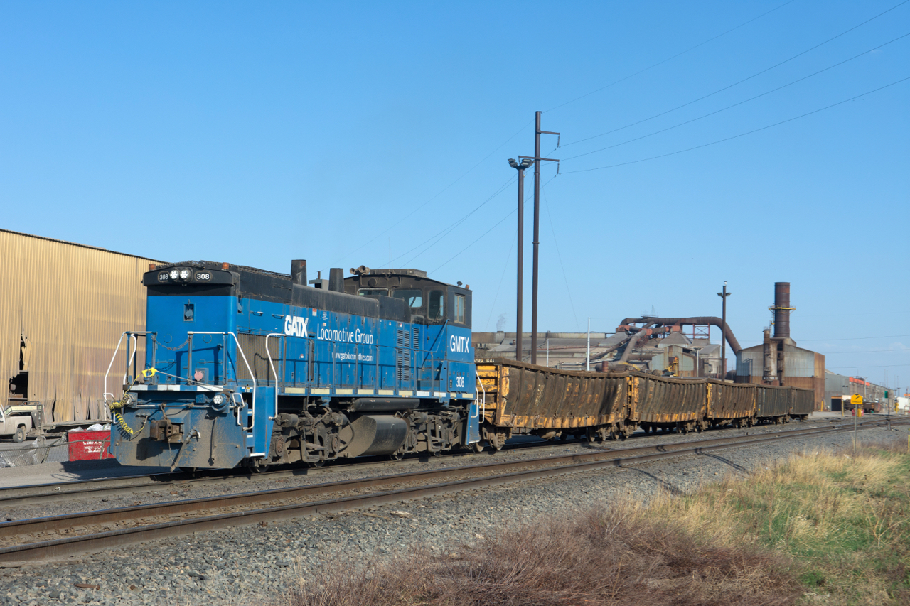 The latest addition to the switcher fleet at Evraz' Regina steel mill is spotted moving some mill gons around the north end of the plant.  Truth be told, this unit has been onsite for quite a while, but trying to catch it somewhere shootable and in decent light has been a challenge.