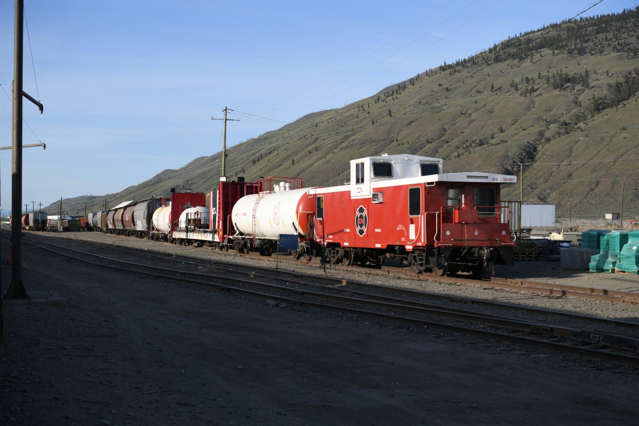 Right-of-Way protection  
Poseidon, one of CN's firefighting trains sits idle on a car repair track at Kamloops, BC yard. 
The four cars in this unique consist were CN 100001 Command Center, CN 100005 tank car, CN 100004 bulkhead flat car, and CN 100009 tank car. 
The early arrival of VIA #1 The Canadian allowed me to detrain and photograph this special equipment just moments before the shadow of the Budd stainless steel equipment engulfed this sunlit view.