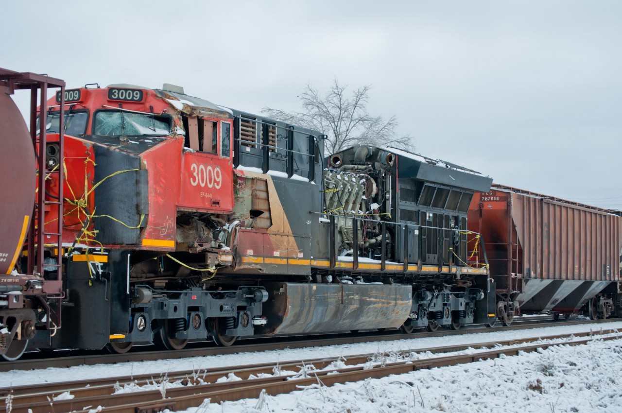 You can imagine the surprise when I saw this battered tier 4 roll by me. CN 3009, which was involved in a train hitting another train derailment in Manitoba earlier in the year, rolls by with a few bumps and scrapes. I was shocked this thing wasn't on a flat car, nor covered in any way. This engine I believe was on the system for less than 5 years at this point. Anyone know if it was scrapped, or what it's outcome was?