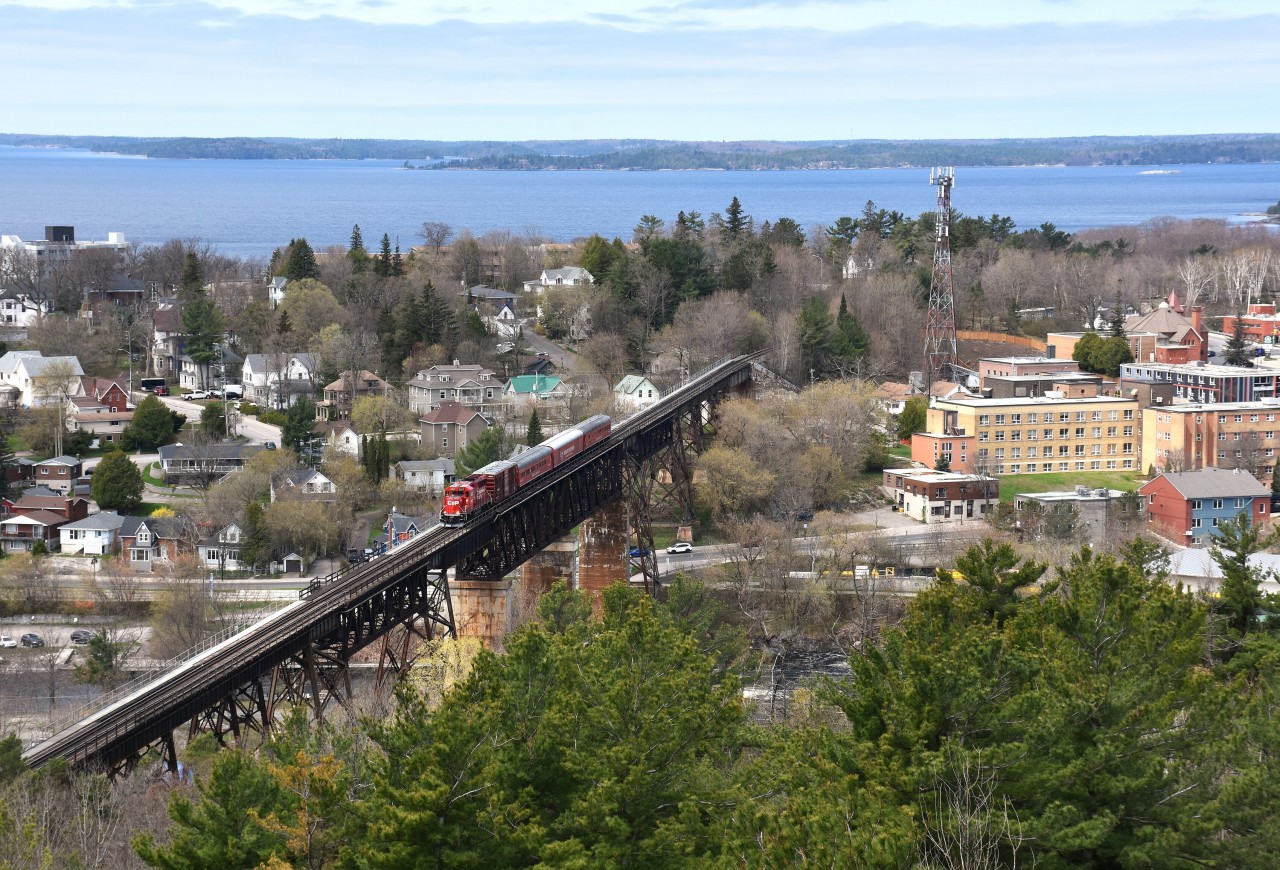 Rather than a closeup shot of the CP Track Evaluation train heading southward over the 1695 foot Parry Sound bridge, I thought an area view would look a bit more dramatic.  The CP #2267-led train is one of those very seldom seen southward moves over this bridge as all CN and CP traffic is northbound these days under a shared asset agreement.
Image was taken from the town's lookout tower; giving me a poor-man's drone shot.