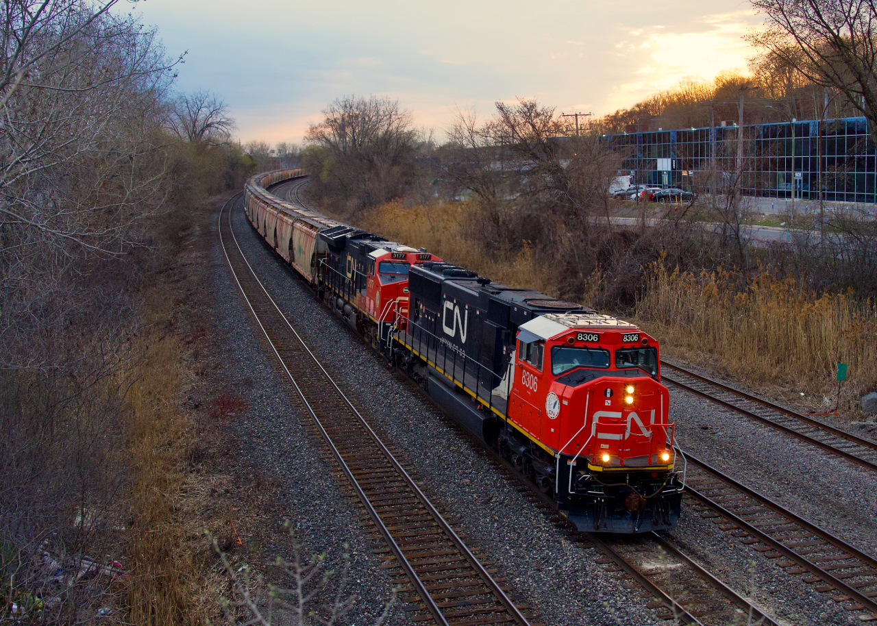 SD75IACC CN 8306 (rebuilt from SD75I CN 5679) leads potash train CN B730 as it approaches the crew change point of Turcot Ouest a bit before sunset.