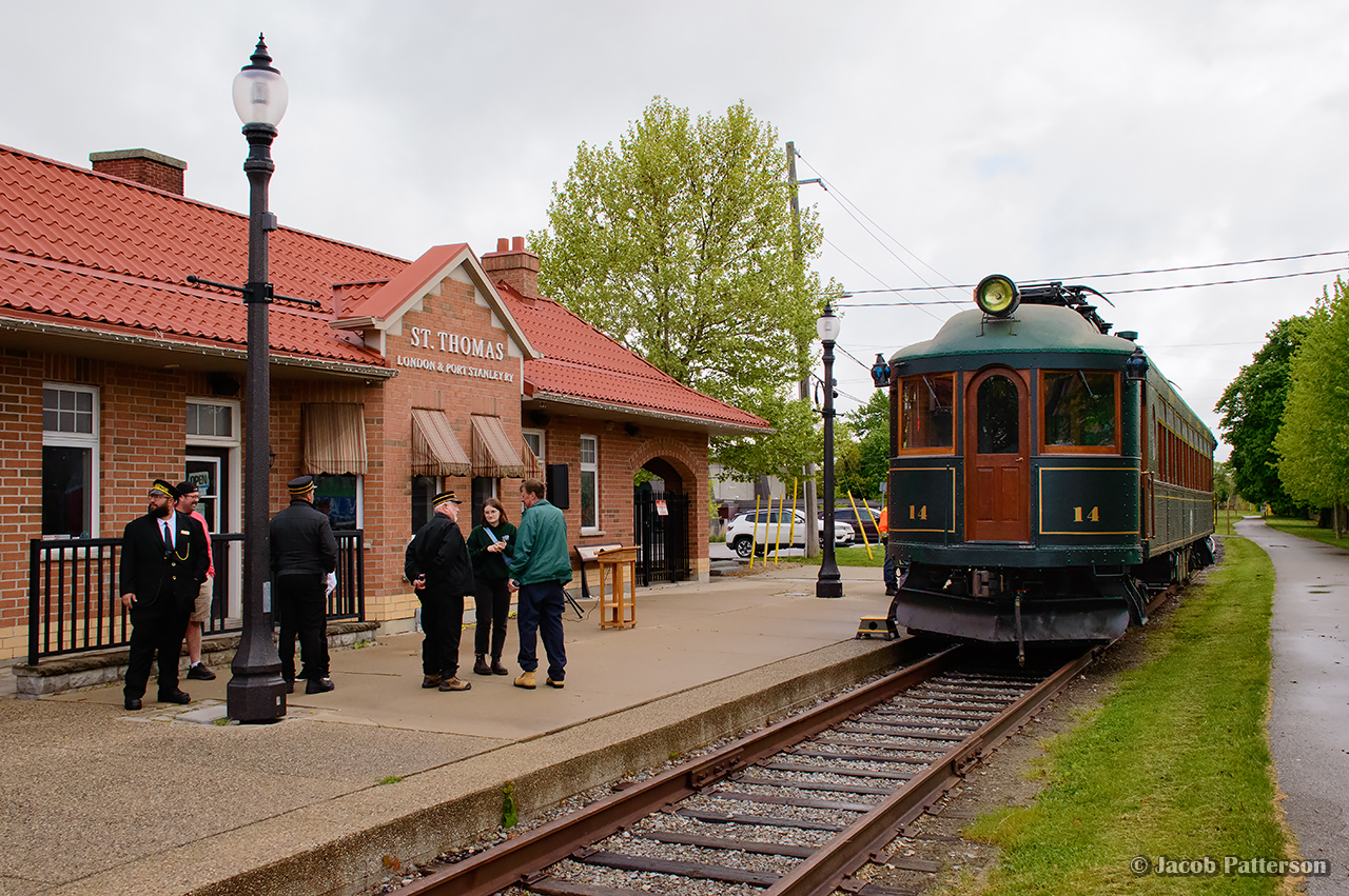 69 years after John Freyseng's photo, L&PS 14 has returned to the L&PS Talbot street station after an extensive restoration by the Elgin County Railway Museum.  Saturday's event marked the first visit of an L&PS interurban to Port Stanley since the end of passenger service in 1957.  This event was the culmination of efforts from members of the Elgin County Railway Museum, Port Stanley Terminal Rail, and the mechanical expertise of the Halton County Radial Railway.

It is just before 0900, and PSTR L3 has spotted L&PS 14 in from of the replica Talbot Street station, built in 2013 as a scaled down version of the L&PS 1916 station, demolished in 1968.  A brief ceremony will begin shortly with dignitaries from the town and museum, with the first run to Port Stanley just afterwards.  The trips were operated, with the first for invited guests, the second for ECRM and PSTR volunteers (stopping at Whytes rather than Port Stanley), and a third trip for the public.  These three trips were in addition to the regular three PSTR trips from Port Stanley to Whytes, with lots of work put in by PSTR crews to ensure smooth train meets throughout the day.

There are intention by the ECRM and PSTR to repeat the event a few times per year.  Kudos to all involved in organizing this event.