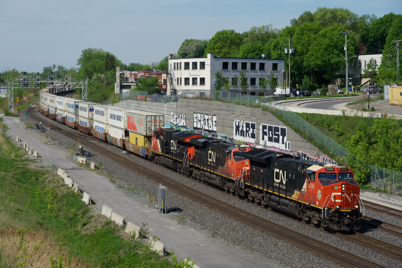 CN 120 heads east with a trio of GEVOs up front.