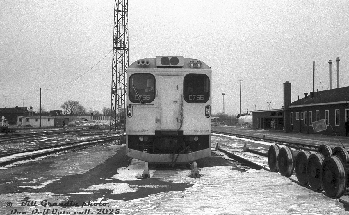 One of GO Transit's old single-level cab cars, C756, sits on a stub track in the east end of Willowbrook Yard in Mimico, next to the old CN car shops that became part of GO's initial maintenance facilities here. On the left are a few local industries along Judson Street, some eventually acquired by GO for yard expansion. Not the inside-bearing wheelsets on the right, specifically for GO's Hawker Siddeley-built passenger equipment.

Bill Grandin photo, Dan Dell'Unto collection negative.