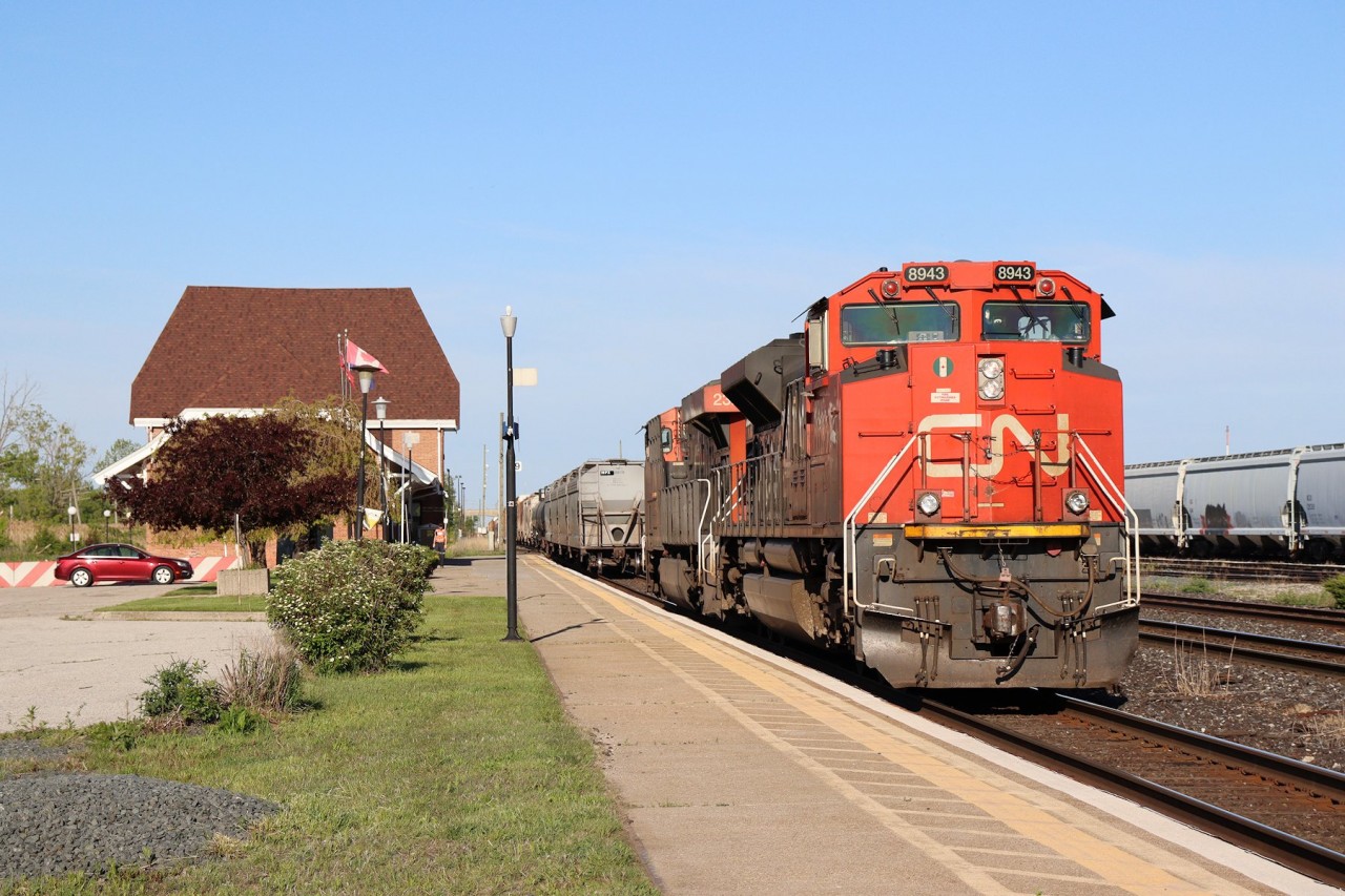 After wying their power due to a PTC issue with the (former) leader preventing them from continuing to the United States, CN 301's engines back onto their train on the north main at Sarnia.
