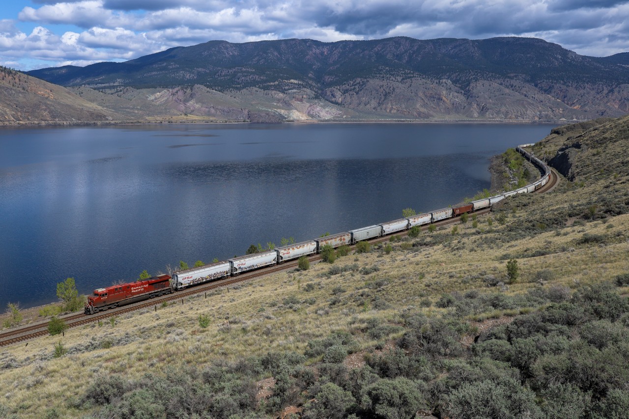CPKC 303-518 skirts the shores of Kamloops Lake, as CN G 84141 20 departs Jaleslie on the other side of the lake.  

CPKC 303-518: CP 8715, CP 8857 - DP 1x0x1 - 120 cars