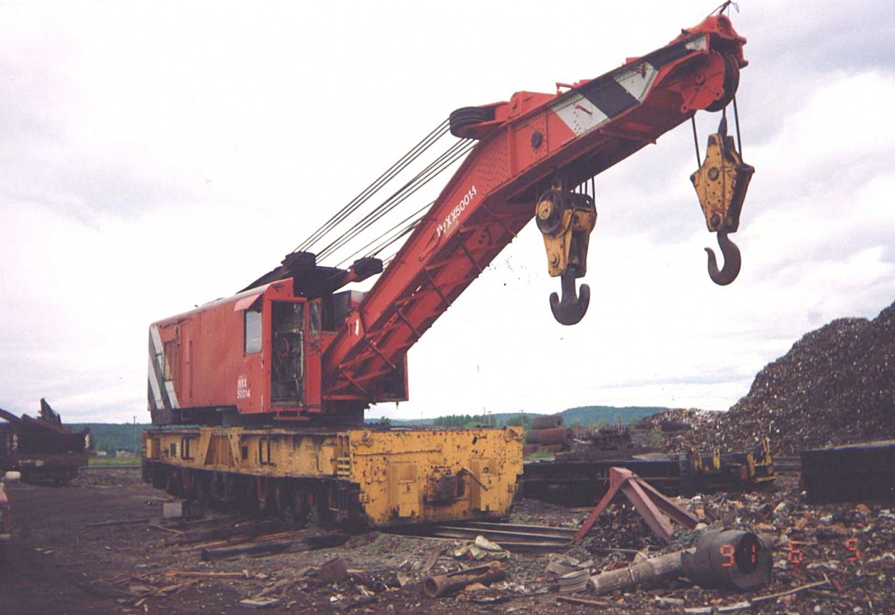 Tired Old Dog  
IVXX 50014 (Ivaco Steel, nee-CN 50014) is an Industrial Works 200-ton wrecking crane, serial number 5137, built in 1928. 
I snapped it sitting on the scrapping track waiting to meet the hot wrench at Ivaco Steel in L'Orignal, ON June 5, 1991. 
It was just a mere 73 years old at the time (34 years ago).