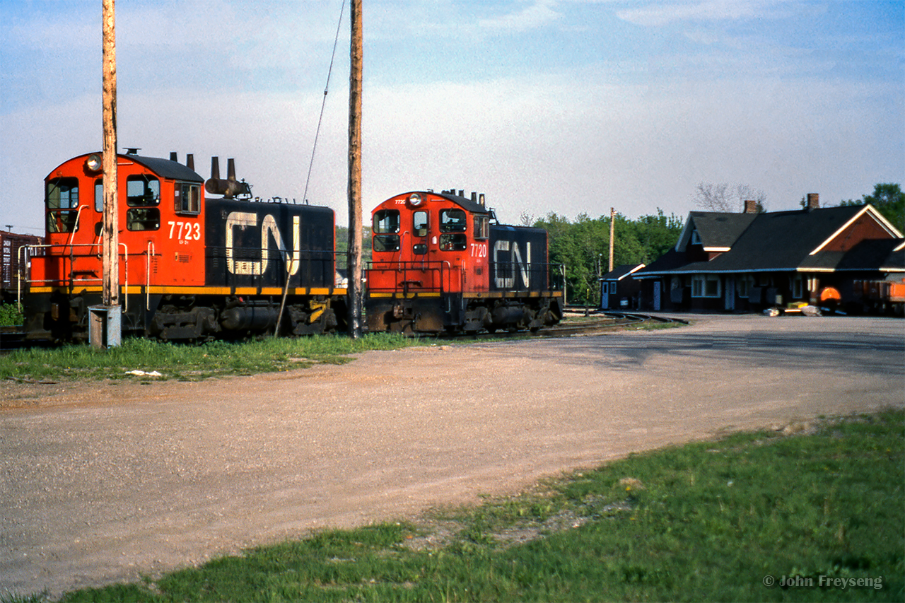 A pair of CN SW1200s sit behind Merritton station.

Scan and editing by Jacob Patterson.