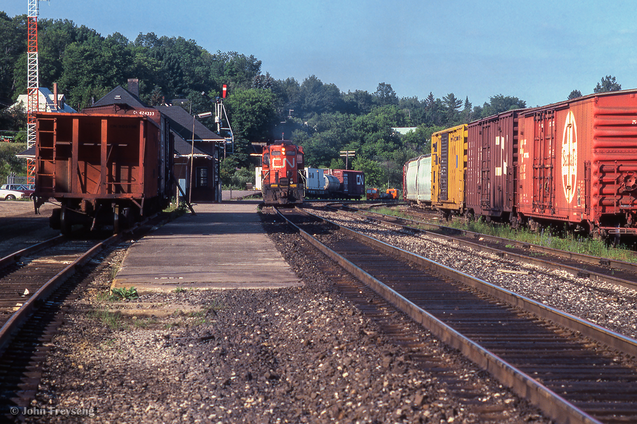Just after going on duty, the crew aboard CN 595 has pulled their GP9 off the stub track at left and heads towards the south end of Huntsville yard.

Scan and editing by Jacob Patterson.