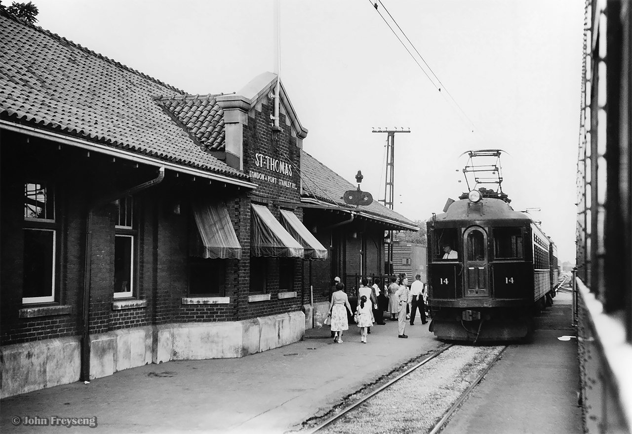 Headed north, L&PS train 13 pulls up to the 1916 St. Thomas Talbot Street station with interurban cars 4 and 10, meeting southbound train 14, with cars 14 and 8. All products of the Jewett Car Company of Ohio, car 14 is the newest of the fleet pictured, being built in 1917, while cars 4, 8, and 10 are products of 1915.  All four cars pictured are preserved today.  Cars 4 and 8 at the Halton County Radial Railway, car 10 at Exporail, and car 14 at the Elgin County Railway Museum.


John Freyseng Photo, Helmut Ostermann Collection Negative.