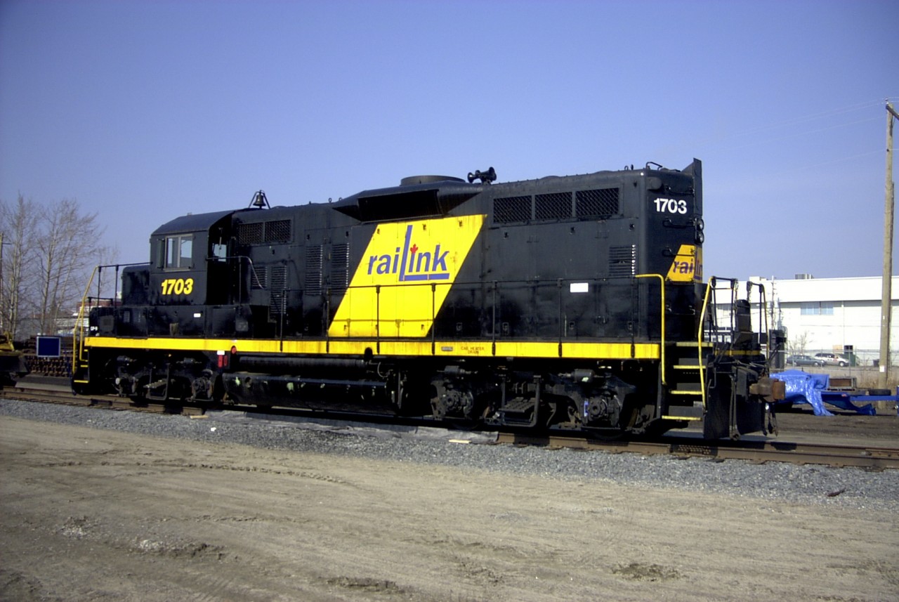 Smell the fresh paint  
Waiting on its next assignment, GP9 RLK 1703 sits in the OVR yard at North Bay, ON April 17, 2002. The smell of freshly applied paint was in the air!