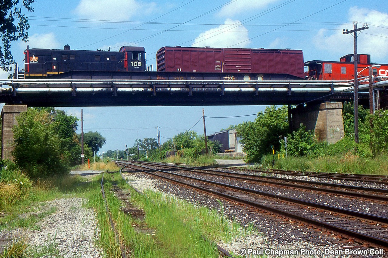 TRRY S-13u 108 heads across the CN Grimsby Sub on the TR Townline Spur to Interlake Paper.
