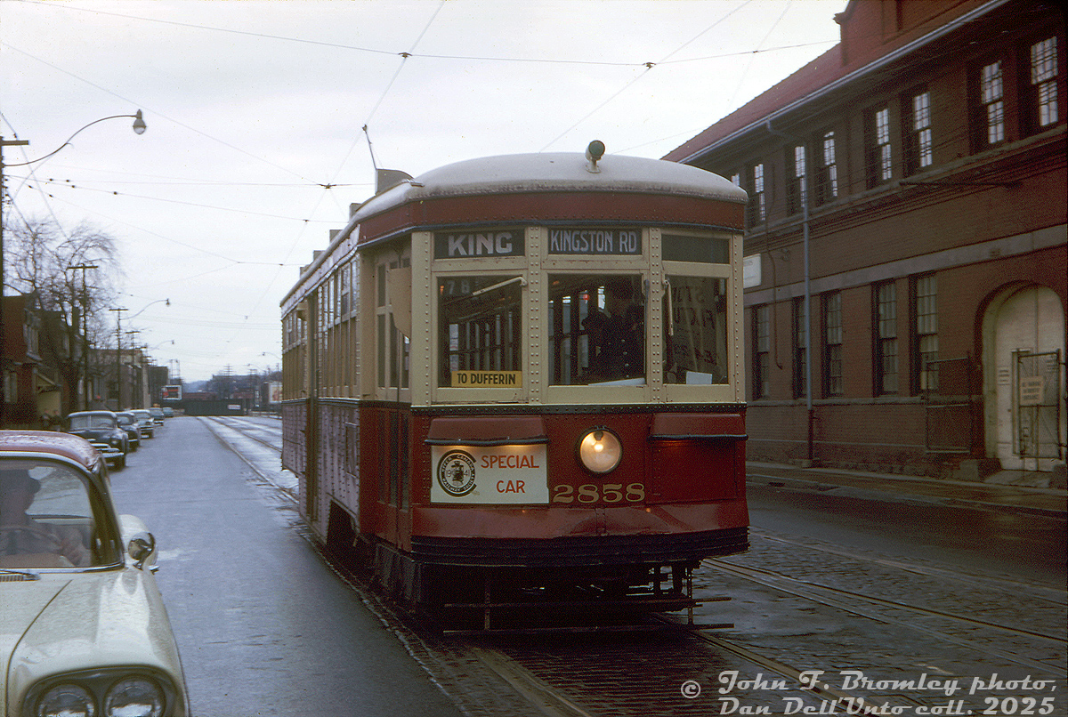TTC "Small Witt" 2858 is out on a Upper Canada Railway Society fantrip on a gloomy day in April 1963. As per an old UCRS newsletter, it was a system-wide excursion that including 16 photo shops. On one such stop, it's posed here southbound on Dufferin Street just north of King Street West.

The interesting part here is this particular spot, and what's going on: there was a crossover here, and the streetcar, facing south on the southbound tracks, was being crossed over in reverse to pose facing south on the northbound tracks. The operator is looking rearward to reverse 2858 through the crossover just behind the car, and there were two other individuals out of view behind car, one pulling the trolleypole cable to the right to guide the pole through the crossover's overhead connecting wire, and another with a pry bar for setting the track switches.

The crossover here was used for a Dufferin summer stub service in the 1920-30's, using a double-ended streetcar to provide service from just past the crossover at King, down Bathurst to Dufferin Loop (to reach the CNE), and back up. This practice occurred occasionally in the mid-1940's too. Since the crossover was still intact, a popular practice during fantrips was to pose streetcars facing the opposite direction, on the wrong side, or crossing over (there was another crossover at George Street below King that was also visited on this day).

By the 1960's, the few remaining Peter Witt streetcars saw little service since the opening of the University subway line in February 1963 (and nixing of the Dupont streetcar route that operated on Bay Street). But, they would be chartered by groups like the UCRS for excursions and fantrips around the city in their final years, until the last cars in the fleet were retired in mid-1965. Some would return in the 1970's for a new "Tour Tram" service.

John F. Bromley photo, Dan Dell'Unto collection slide.