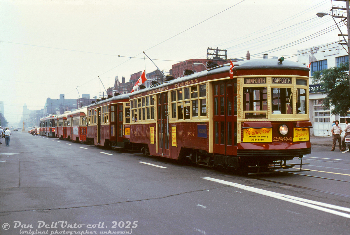 As part of the NRHS convention held in Toronto (that featured a visit by a special train pulled by Southern/N&W power), some streetcar equipment was also chartered during the visit. Seen here, Peter Witt streetcars 2894 & 2766 (rebuilt for Tour Tram service in the early 70's), PCC's 4675 (A12-class, ex-Louisville/Cleveland), 4701 (A13-class, ex-Birmingham), and brand new CLRV's 4000 and 4014 pose for photos along Spadina Avenue just south of College, facing northbound at Oxford Street. Attendees are lined up on the left taking photos, as some operators lounge on the other side of the street. TTC supervisor vehicles are parked at the rear, protecting the stopped lineup of streetcars.

Original photographer unknown (possibly a Charles Houser photo), Dan Dell'Unto collection slide.
