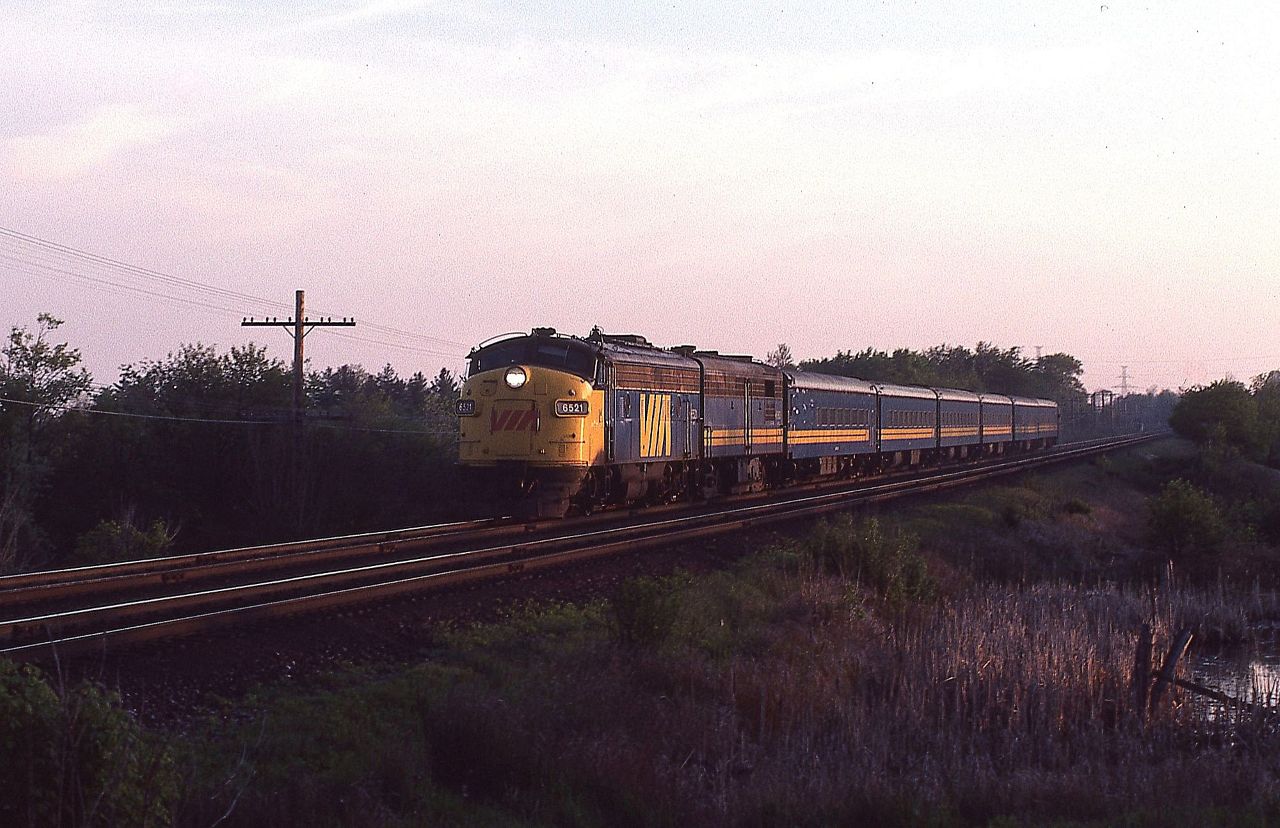 VIA train 68 slows for its stop at Kingston, Ontario on May 21, 1980.  Power for the 6 car train was 6521 and 6863.